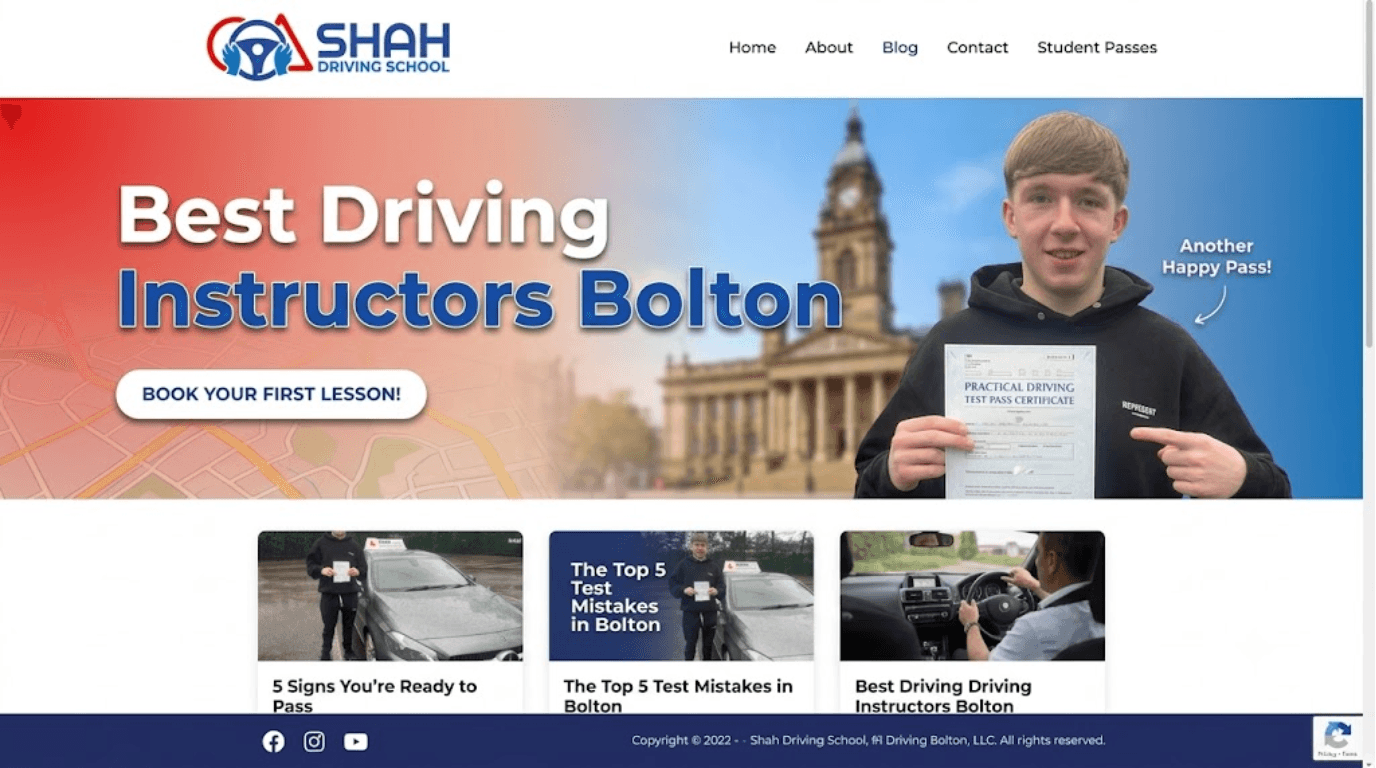 A professional website banner for Shah Driving School in Bolton featuring a happy student holding a driving test pass certificate next to a car, with the text "Best Driving Instructors Bolton" and a "Book Your First Lesson" call-to-action button.