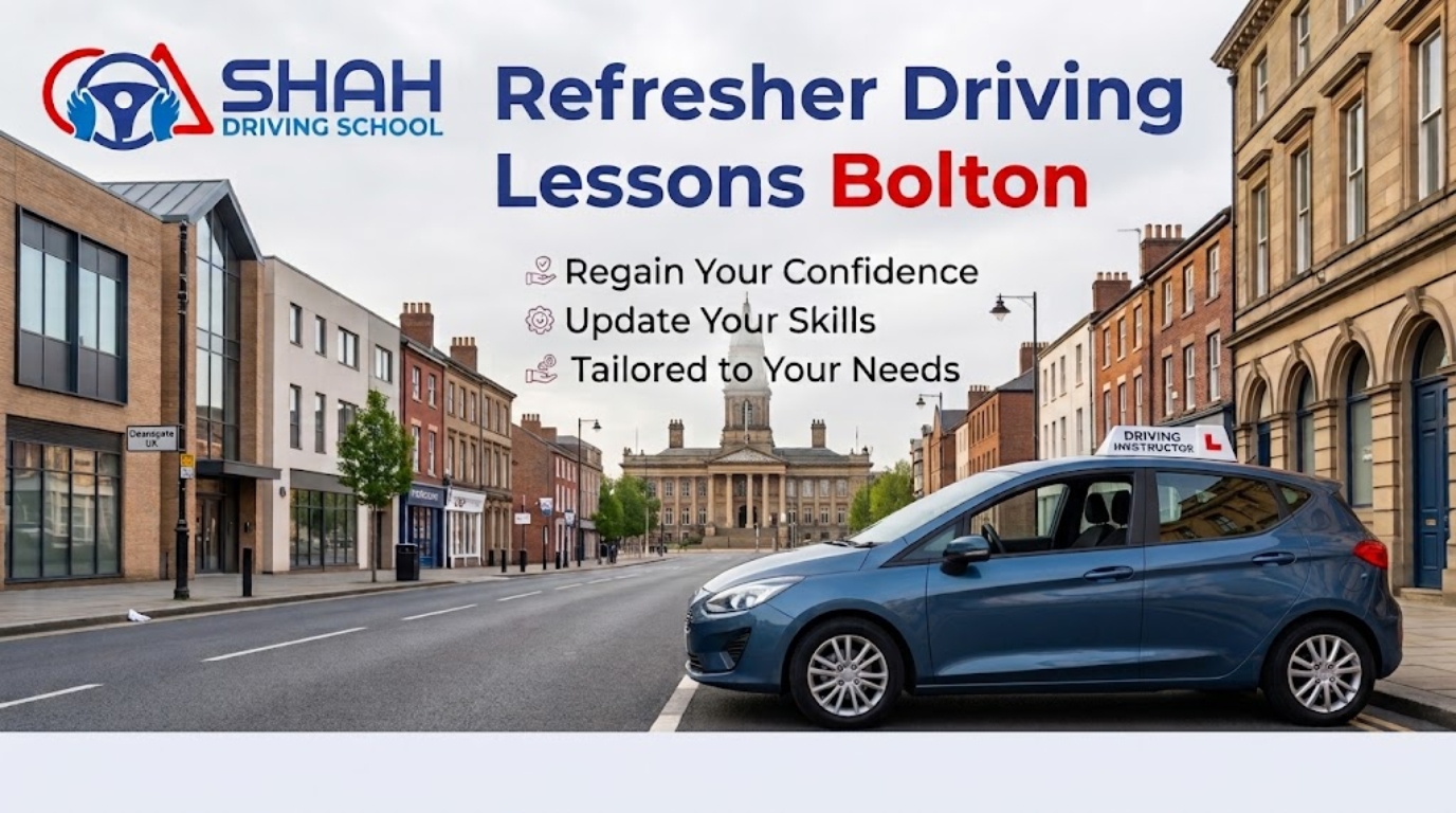 A professional website banner for 'SHAH Driving School Bolton'. The top-left corner features the company logo: a stylized steering wheel with red and blue accents. Large blue text in the center reads "Refresher Driving Lessons" followed by "Bolton" in red text. Below the title, there is a bulleted list of benefits: "Regain Your Confidence," "Update Your Skills," and "Tailored to Your Needs," each marked with a unique icon. In the foreground on the right, a modern blue five-door car with a "DRIVING INSTRUCTOR" roof sign is parked on a historic British street. The background is a wide perspective looking down 'Deansgate UK' (as seen on a street sign) towards a large, prominent neoclassical stone building, likely Bolton Town Hall, under a cloudy sky. The street is lined with traditional and modern storefronts.