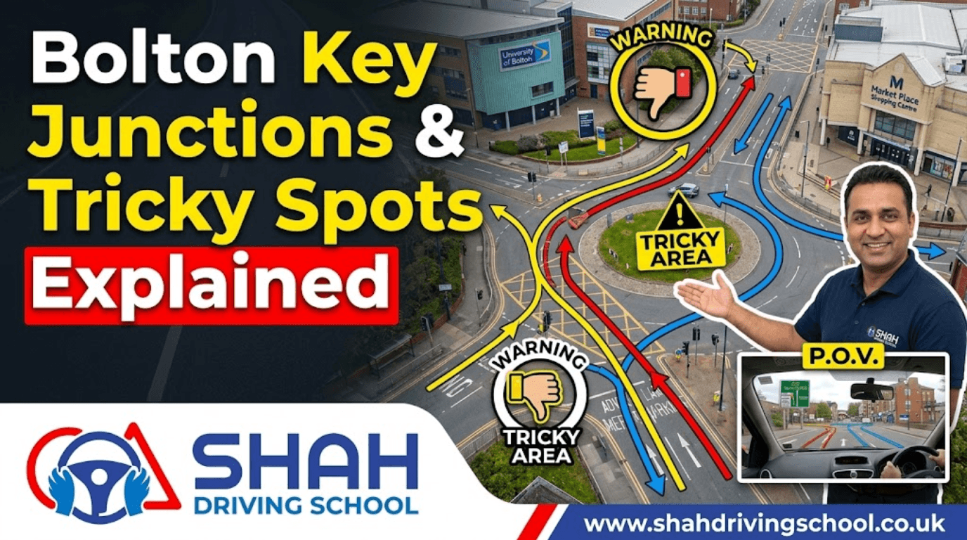 An instructional YouTube thumbnail for Shah Driving School featuring an aerial view of the complex St. George's Road/Topp Way junction in Bolton. A smiling instructor is pointing to the map, which includes the University of Bolton and Market Place Shopping Centre. Warning icons and color-coded arrows (red for complex paths, yellow for warnings, blue for correct routes) highlight "Tricky Areas," with the text "Bolton Key Junctions & Tricky Spots Explained." The Shah Driving School logo is in the corner.