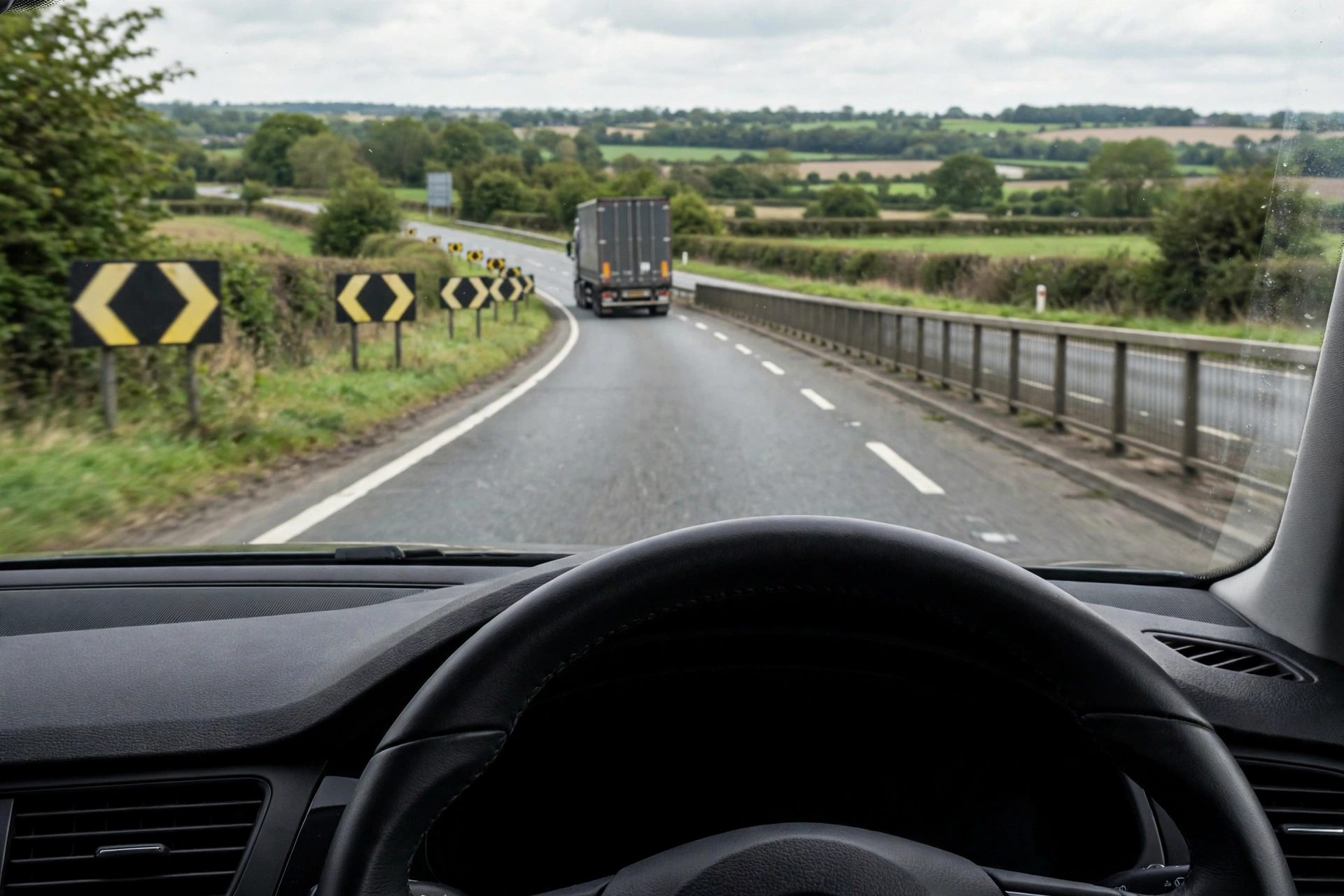 Driver's view from a learner car keeping a safe two-second following gap behind a lorry on a UK dual carriageway
