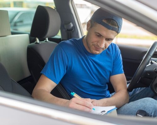 delivery-guy-car-signing-document_23-2148546126